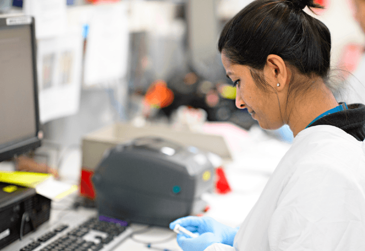Researcher at her desk working in front of her computer